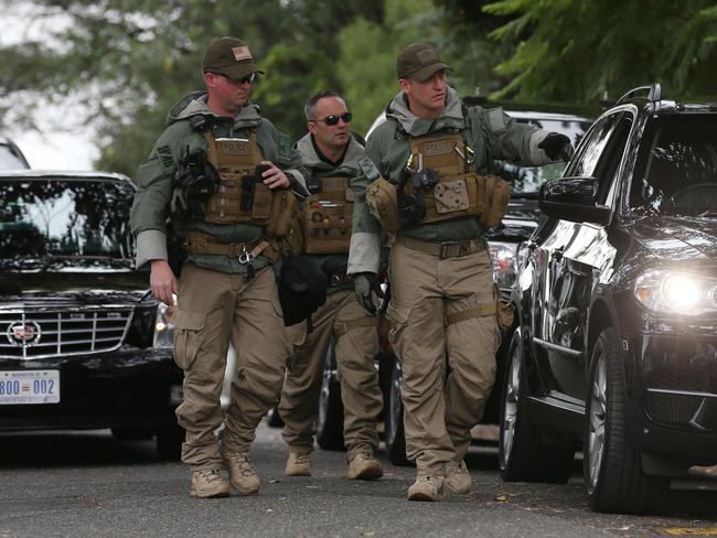 Heavily-armed American Secret Service agents work the area surrounding Kirribilli House in Sydney.