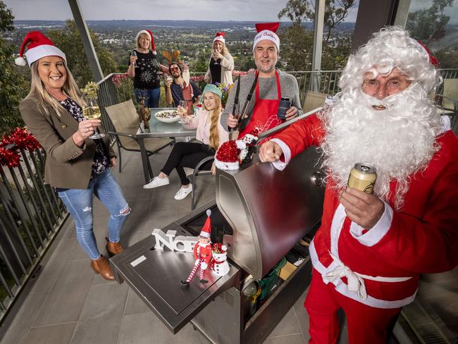 Covid Christmas BBQ time. McLean family xmas. (l-r) Di, Robyn, Kobe, LArni, Keely,  Neil (on the bbq and George (santa) are looking forward to enjoying an xmas bbq. Picture: Jake Nowakowski