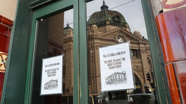 A closed sign on the door of Young and Jackson pub across from Flinders Street Station. Picture: NCA NewsWire/ David Crosling