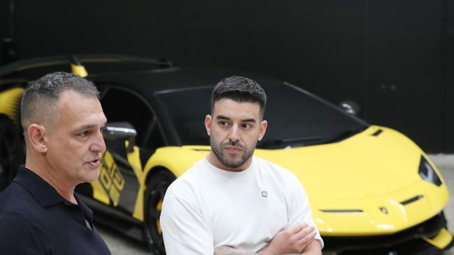 Portelli (right) and his beloved yellow Lambo, just one of a fleet of luxury cars he owns. Picture: NewsWire/ David Crosling