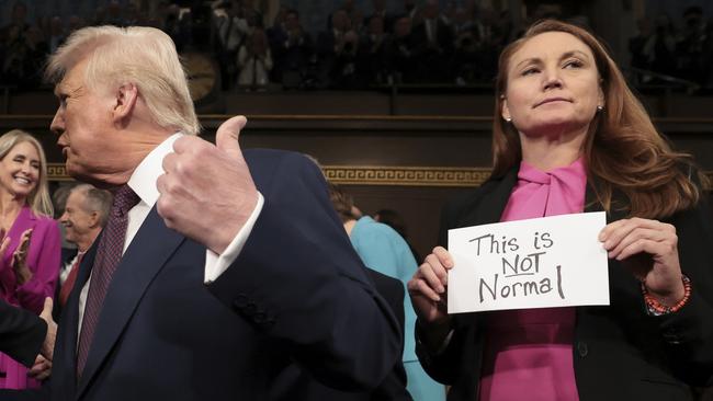 President Donald Trump arrives at congress as Democrat Melanie Stansbury makes her feelings clear. Picture: AP