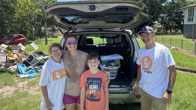 Donna Seri and Dr Rahul Dua with recipients of donated goods in Ingham. Picture: Evan Morgan