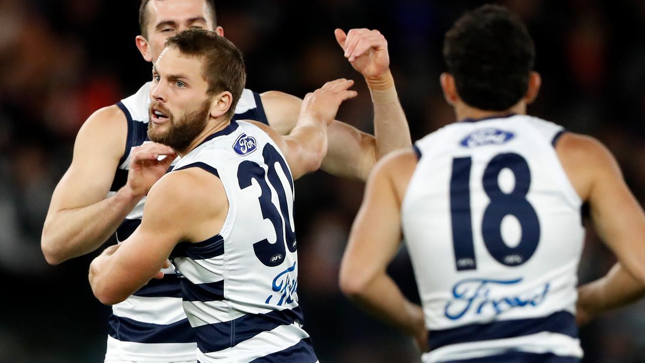 Tom Atkins celebrates one of the Cats’ seven goal first quarter blitz over the Bulldogs on Friday night. Picture: Getty Images