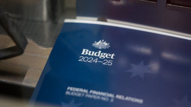 Treasurer Jim Chalmers hands down budget surplus as he focuses on ...