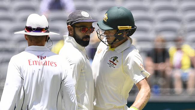 Virat Kohli (left) and Tim Paine clash in Perth. Picture: AAP