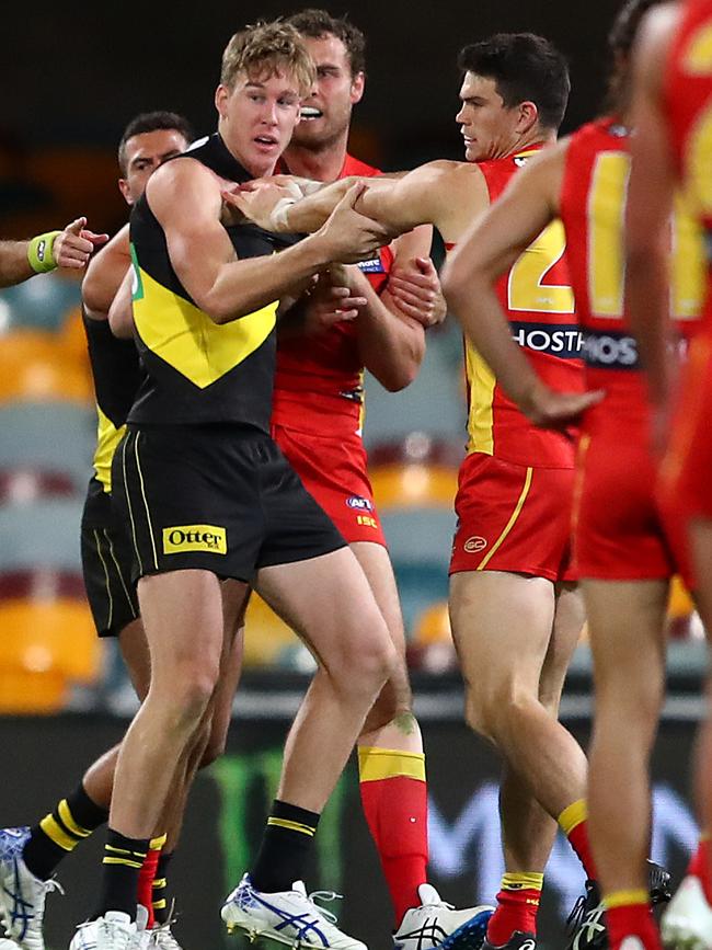 Richmond’s Tom Lynch scuffles with Sam Collins of the Suns at the Gabba. Picture: Getty Images