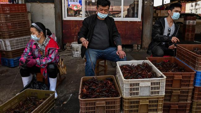 Vendors at a seafood market in Wuhan, China. Picture: AFP