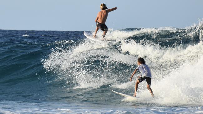 Surfers enjoy the swell on the Gold Coast generated by Tropical Cyclone Oma. Picture: Mark Furler.