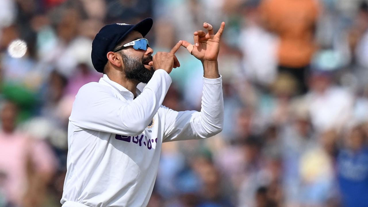 India's captain Virat Kohli gestures towards a trumpet-playing England fan during their day five victory over England at the Oval. Photo: AFP