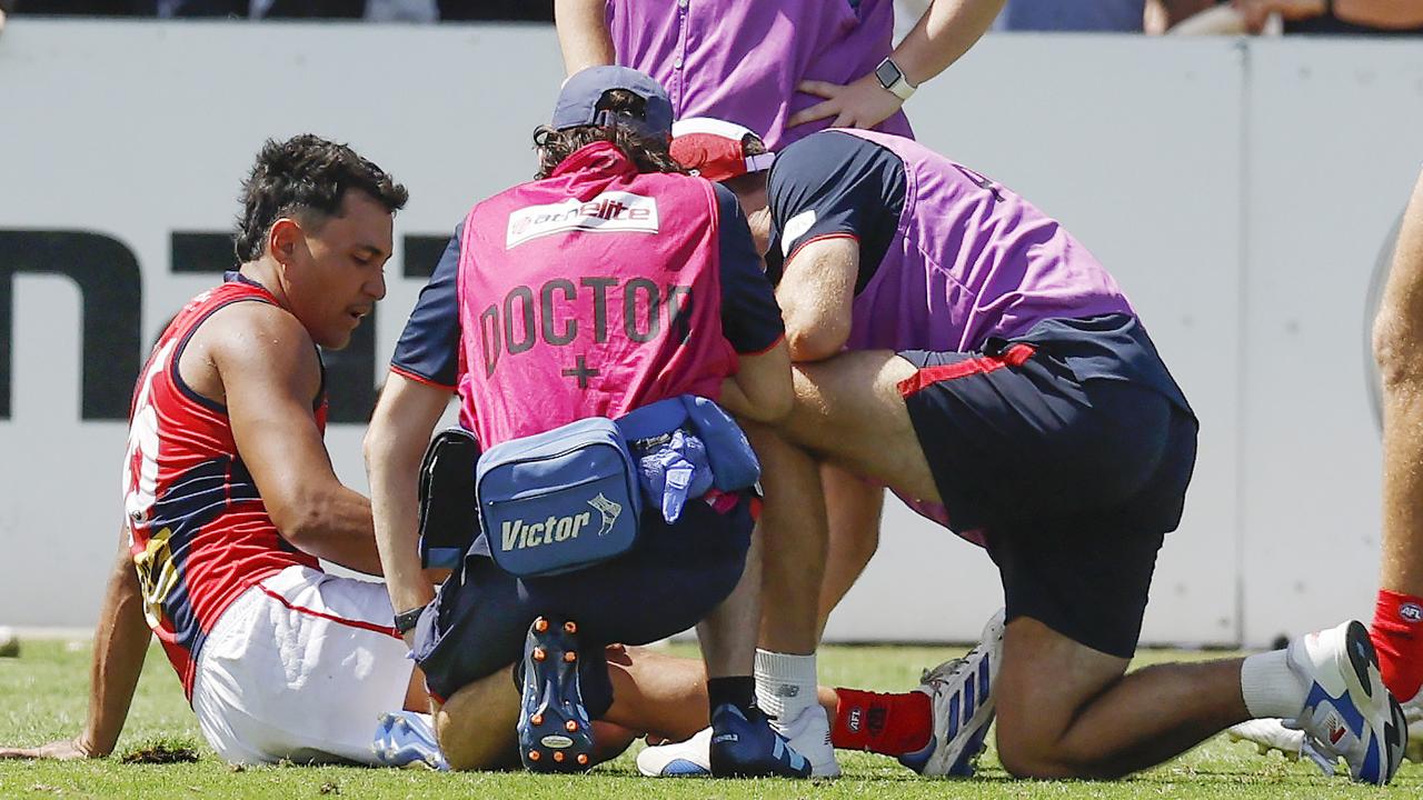 Trainers helped Andy Moniz-Wakefield from the ground after the injury. Picture: Michael Klein