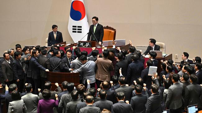 South Korea's ruling People Power Party lawmakers query Speaker Woo Won-shik at the National Assembly in Seoul on Friday. Picture: AFP