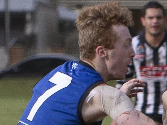 ADELAIDE, AUSTRALIA - Advertiser Photos JUNE 26, 2021: Payneham Norwood Union  Player #48 Seb Bower is held back in the Division one Adelaide Footy League match between Payneham Norwood Union and Unley Mercedes at Payneham Oval. Picture: Emma Brasier