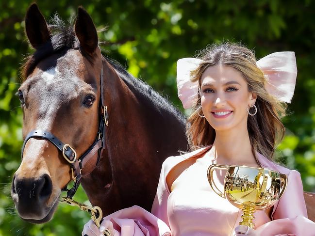 Delta Goodrem with the Melbourne Cup and 2020 winner Twilight Payment. Picture: Ian Currie