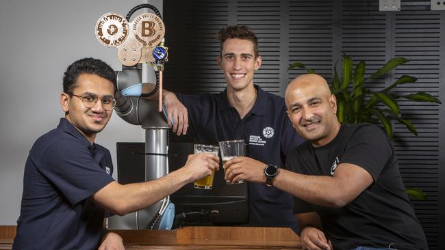 Celebrating Barossa Valley Brewing’s AI-generated pale ale are, from left, designers Josh Vira and Christopher Fusco with collaborator Denham D'Silva at the Australian institute of Machine Learning at Lot Fourteen. Picture: Emma Brasier