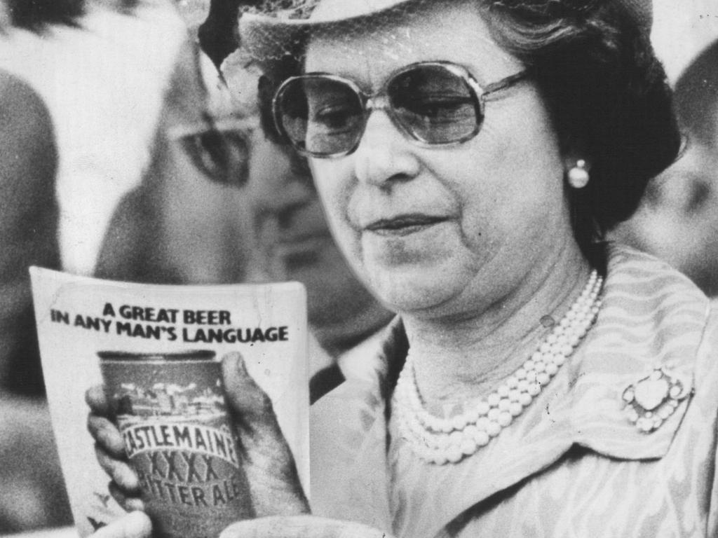 <b>1982 – Brisbane</b> An award-winning shot from young <i>Daily Sun</i> photographer Flora Sacco shows the Queen checking out the program at the 1982 Commonwealth Games in Brisbane. Despite the Queen’s presence and the efforts of athletes like Raelene Boyle, it was another woman who stole the show – Matilda, a 13m-high mechanical kangaroo, rolled around the stadium in the opening and closing ceremonies winking at the crowd.