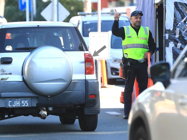 Police remain at border closures in Coolangatta due to the Covid 19 pandemic. Pics Adam Head