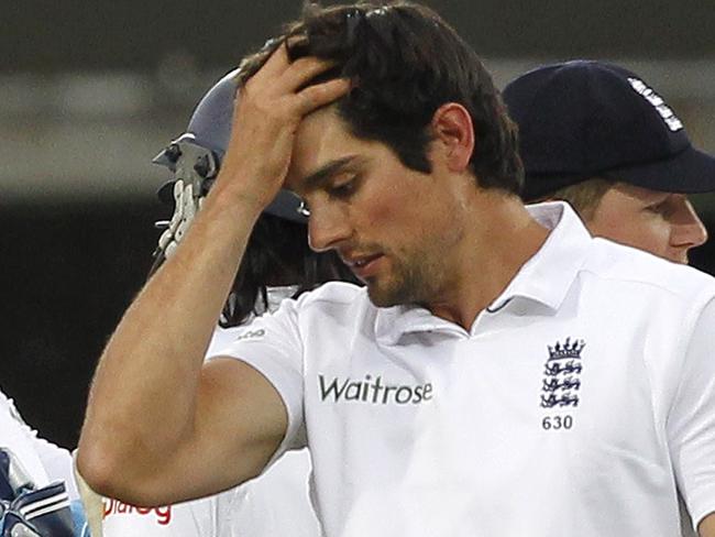 England’s Captain Alastair Cook (R) reacts as the match is drawn on the fifth and final day of the first cricket Test match between England and Sri Lanka at Lord's cricket ground in London on June 16, 2014. England and Sri Lanka drew the first Test at Lord's in dramatic fashion to leave their two-match series all square at 0-0. Sri Lanka, set 390 to win after England captain Alastair Cook declared before play on the fifth and final day, were left clinging on at 201 for nine come the close. AFP PHOTO / IAN KINGTON RESTRICTED TO EDITORIAL USE. NO ASSOCIATION WITH DIRECT COMPETITOR OF SPONSOR, PARTNER, OR SUPPLIER OF THE ECB