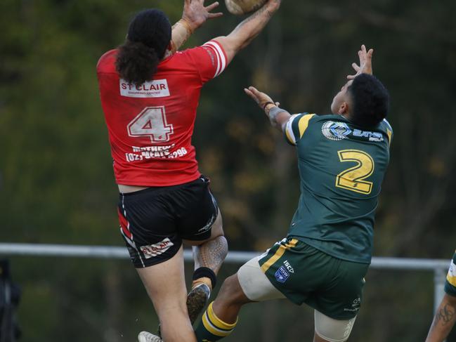 Viliami Fonokalafi (No.2) and Leha Fakatava (No.4) fly high. Picture Warren Gannon Photography