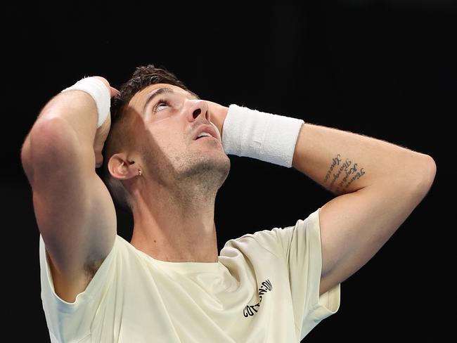 MELBOURNE, AUSTRALIA - JANUARY 18: Thanasi Kokkinakis of Australia reacts in their round two singles match against Grigor Dimitrov of Bulgaria during the 2024 Australian Open at Melbourne Park on January 18, 2024 in Melbourne, Australia. (Photo by Darrian Traynor/Getty Images)