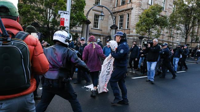 Police and protesters on Macquarie St towards William St in the CBD to protest against climate action in Sydney. Picture: Gaye Gerard.