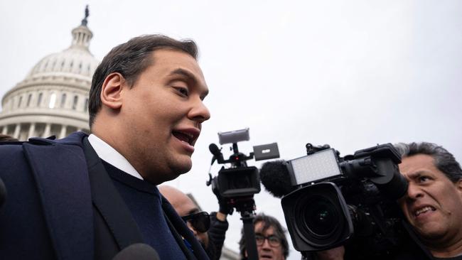 Republican George Santos is surrounded by journalists as he leaves the US Capitol after his fellow members of Congress voted to expel him. Picture: AFP