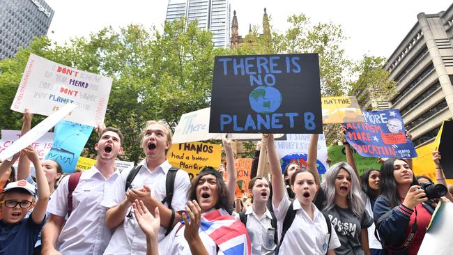 Thousands of school students from across Sydney attend the global #ClimateStrike rally at Town Hall in Sydney, Friday, March 15, 2019. Hundreds of thousands of students are expected to strike worldwide demanding urgent political action on climate change. (AAP Image/Mick Tsikas) NO ARCHIVING