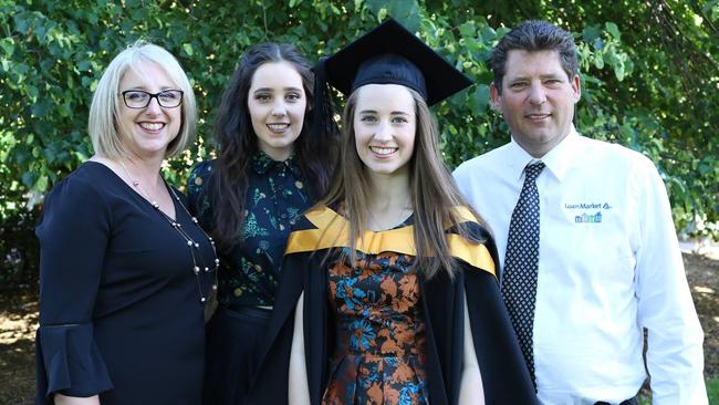 Shark attack victim Justine Barwick, left, of Burnie with her husband and two daughters.