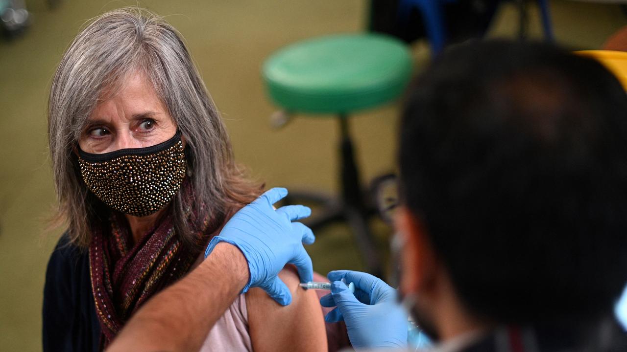 A member of the public receives a dose of a Moderna Covid-19 booster vaccine jab at a temporary coronavirus vaccination centre in London. Picture: AFP.