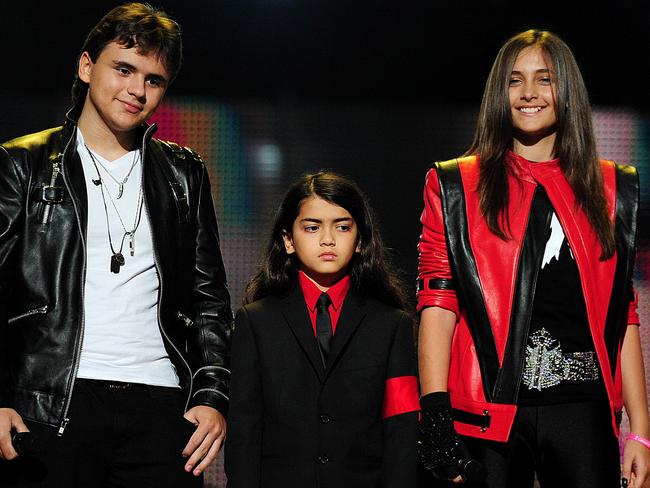 Michael Jackson's children, Prince Jackson, Blanket Jackson and Paris on stage during the 'Michael Forever' concert in 2011. Picture: AFP Photo/Leon Neal