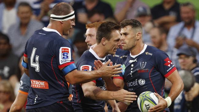 Tom English of the Rebels (right) celebrates a try during the Round 3 Super Rugby match between the Melbourne Rebels and the Highlanders at AAMI Park in Melbourne, Friday, March 1, 2019. (AAP Image/Daniel Pockett) NO ARCHIVING, EDITORIAL USE ONLY