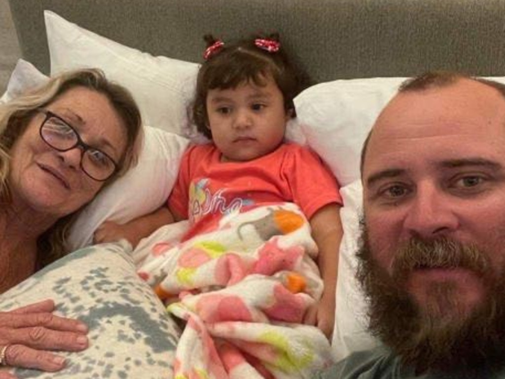 Adelynn, 2, has been reunited with her Mackay uncle Ben Shanks and Brisbane grandmother Leanne in Cancun, Mexico after she was dumped at church. Her parents remain missing. Picture: Supplied