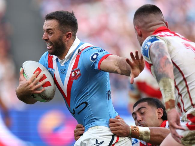 SYDNEY, AUSTRALIA - APRIL 25: James Tedesco of the Roosters is tackled during the round eight NRL match between the Sydney Roosters and St George Illawarra Dragons at Allianz Stadium on April 25, 2025, in Sydney, Australia. (Photo by Cameron Spencer/Getty Images)