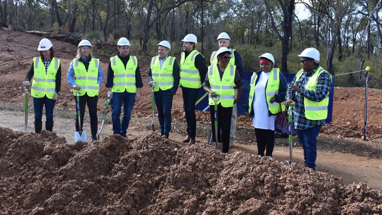 Dignitaries conduct the sod-turning ceremony yesterday.