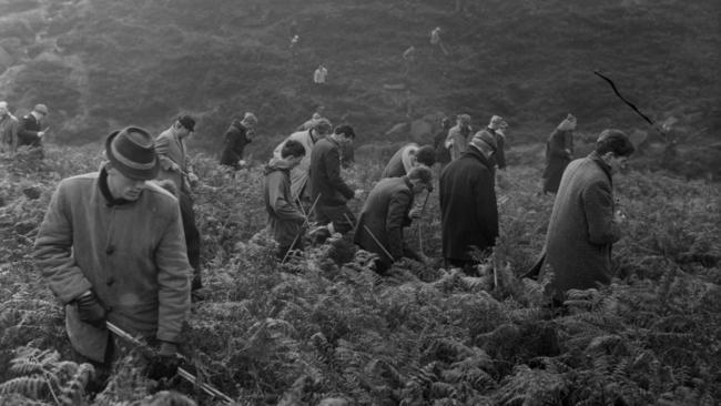 Police search the Saddleworth Moor, Manchester, for the victims of mass murderers Myra Hindley and Ian Brady in October 1965.