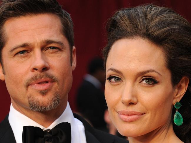 (FILES) a picture taken on February 22, 2009 shows Brad Pitt and Angelina Jolie arriving at the 81st Academy Awards at the Kodak Theater in Hollywood, California. Hollywood's hottest couple has made it official on April 14, 2012, with Brad Pitt proposing to Angelina Jolie after six children and years of unwedded bliss. AFP PHOTO/ ROBIN BECK