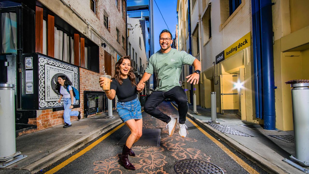City workers Maddie Ford and Brian Maan in the trendy Burnett Lane. Picture: Nigel Hallett