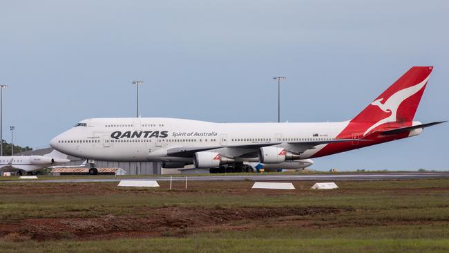 A Qantas flight lands at Darwin Airport ... Qantas today said it could not rule out the coronavirus crisis impacting services to the Territory. Picture: Helen Orr