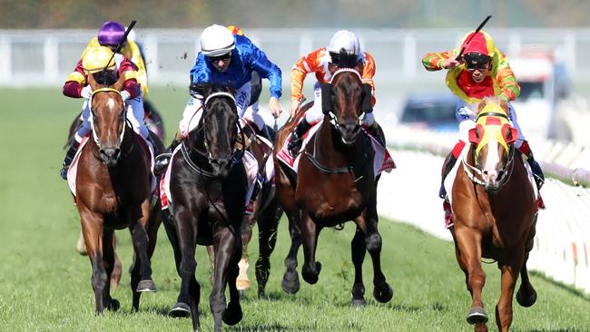 Caulfield Guineas race Day at Caulfield Racecourse. The Ladbrokes Caulfield Guineas race 8. Jockey Michael Walker rides Mighty Boss to victory. Picture: Alex Coppel.