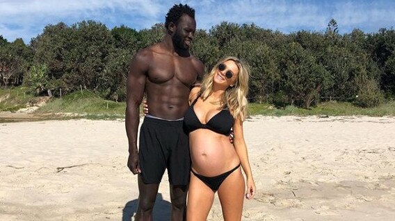 Majak Daw and partner Emma McKay in Byron Bay. They are expecting their first child. Picture: Instagram