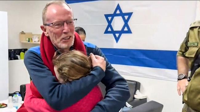 Nine-year-old Irish Israeli former hostage Emily Hand embracing her father at a hospital in Israel after being released by Hamas. Picture: AFP