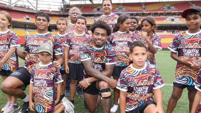 Selwyn Cobbo and Ezra Mam with a group of Deadly Choices kids on Monday 11th March 2024. Photo: Steve Pohlner