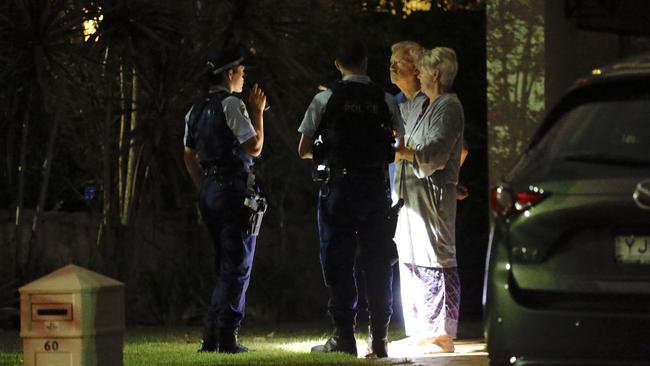 Neighbours being interviewed by police after the Kellyville home invasion.