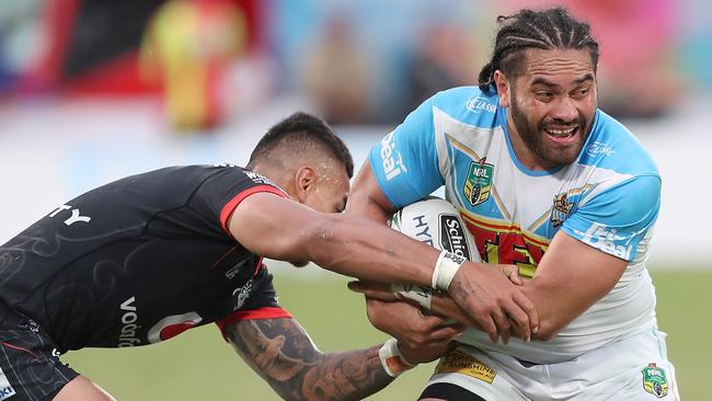 Konrad Hurrell of the Titans is tackled by Ken Maumalo of the Warriors at Mount Smart Stadium in Auckland. Photo: AAP