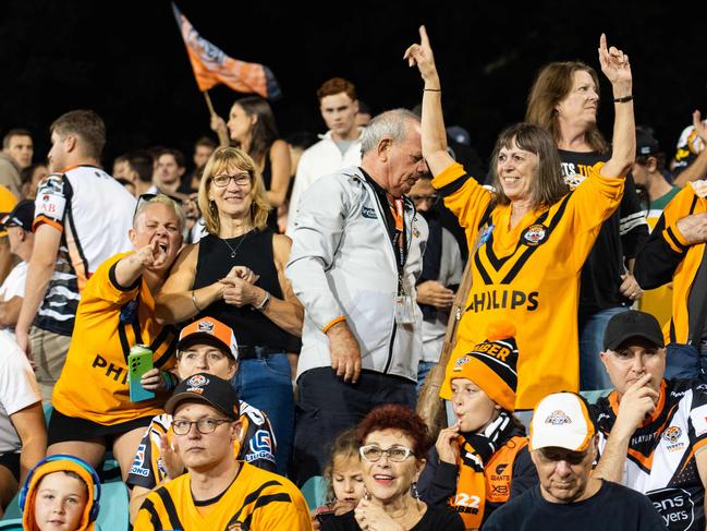 Tigers fans celebrate their teams win over the Sharks.Photo: Tom Parrish