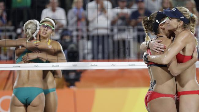 United States' Kerri Walsh Jennings and April Ross celebrate after beating Australia's Taliqua Clancy, 2nd left, and Louise Bawden after their women's beach volleyball quarterfinal. Picture: AP