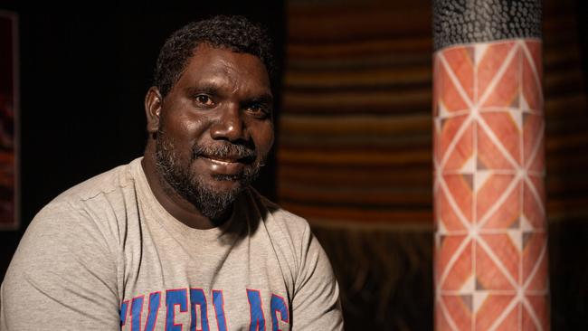 Maningrida artist and Kuninjku man Obed Namirrkki standing next to his Telstra National Aboriginal and Torres Strait Islander Art award-winning work award 'Kunkurra' at MAGNT. Picture: Pema Tamang Pakhrin