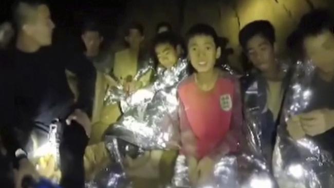 The Thai boys with Navy SEALs inside a cave in northern Thailand before their dramatic rescue that has captivated the world. Picture: Thai Navy Seal via AP