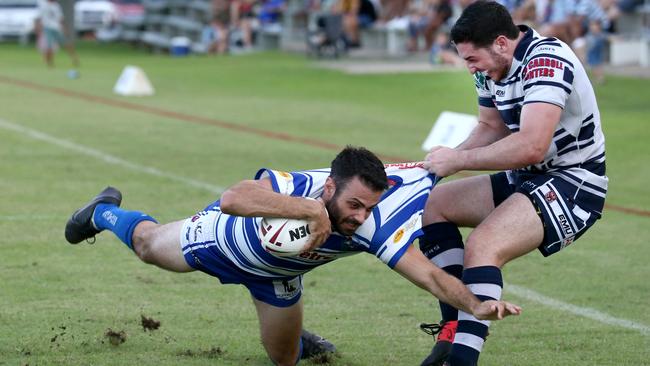 Cairns Brothers’ Luke Fleming is tackled by Townsville David Musumeci as he scores a try PICTURE: ANNA ROGERS