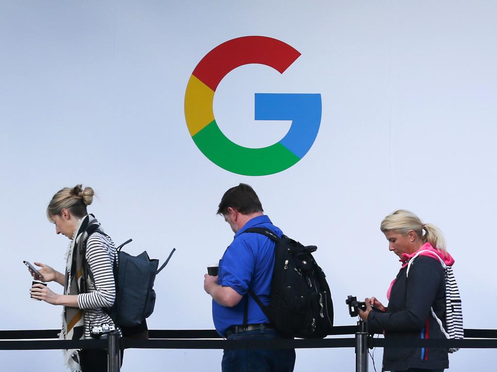 (FILES) In this file photo taken on October 04, 2017, attendees wait in line to enter a Google product launch event at the SFJAZZ Center in San Francisco, California. - Google said it will temporarily stop running political ads starting on January 14, 2021, due to the risk of promoting more violence like the deadly attack on the US Capitol building. (Photo by Elijah Nouvelage / AFP)