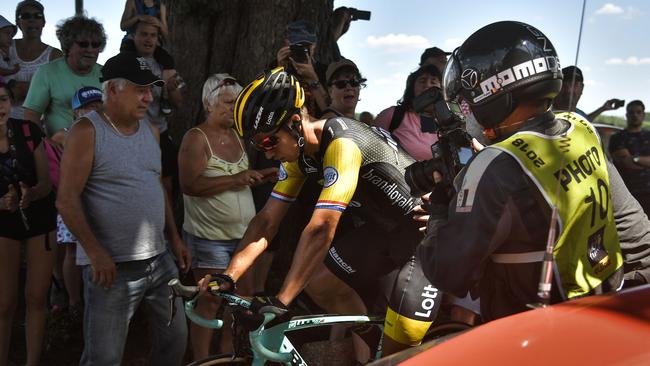 Dylan Groenewegen gets going again after coming down, but unlike Richie Porte, he manages to continue. Picture: AFP